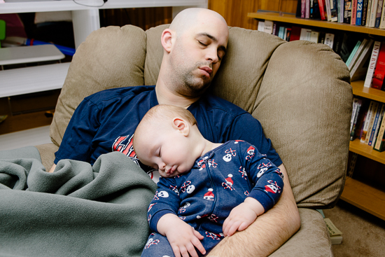 sleeping child in father's arms